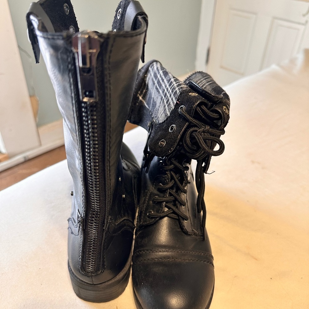 Black adjustable length combat boots.